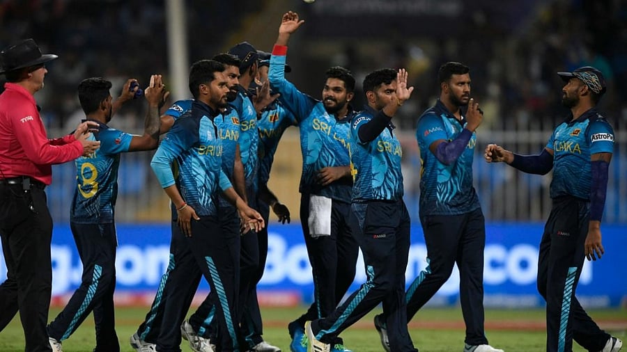 Sri Lanka's cricketers celebrate the dismissal of Netherland's Paul van Meekeren (not pictured) during the ICC men’s Twenty20 World Cup cricket match between Sri Lanka and Netherlands at the Sharjah Cricket Stadium in Sharjah. Credit: AFP Photo