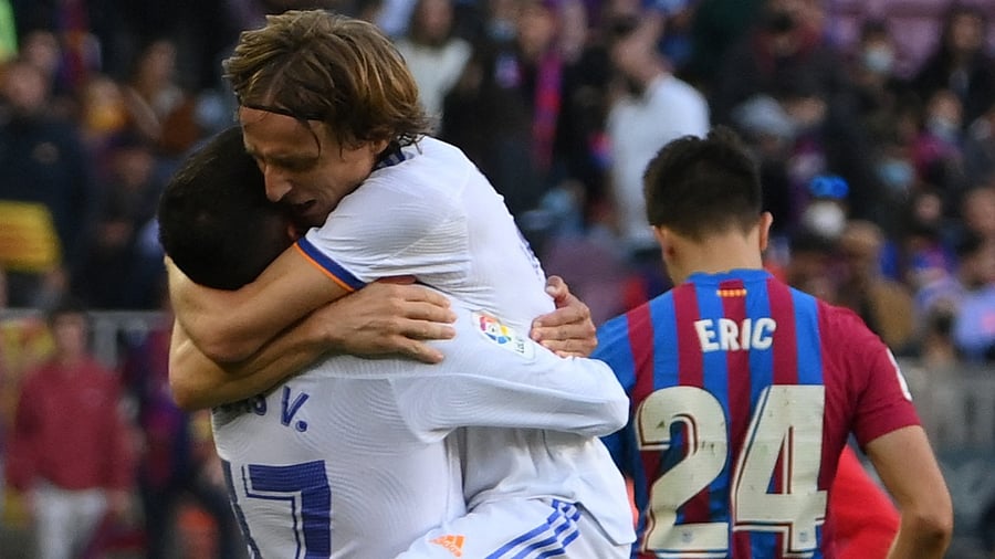 Real Madrid's Spanish forward Lucas Vazquez (L) celebrates with teammate Real Madrid's Croatian midfielder Luka Modric. Credit: AFP Photo