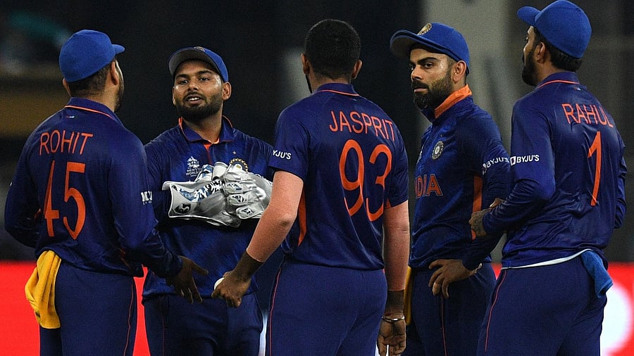 India's Rohit Sharma, Rishabh Pant, Jasprit Bumrah, captain Virat Kohli and KL Rahul discuss during the ICC men’s Twenty20 World Cup cricket match between India and Pakistan at the Dubai International Cricket Stadium in Dubai on October 24, 2021. Credit: AFP Photo