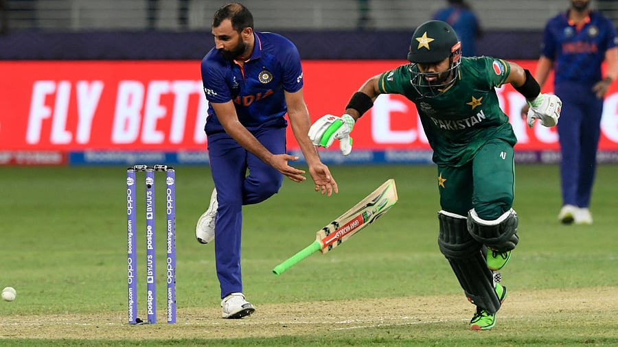 Mohammad Rizwan (2R) takes the winning run in the ICC men’s Twenty20 World Cup cricket match between India and Pakistan. Credit: AFP Photo
