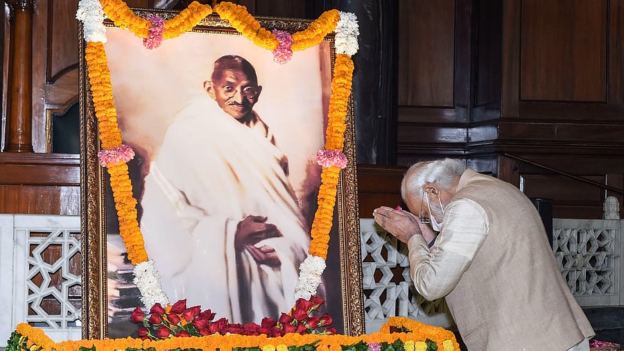 Prime Minister Narendra Modi pays tribute to Mahatma Gandhi on his birth anniversary at Parliament House, in New Delhi. Credit: PTI File Photo