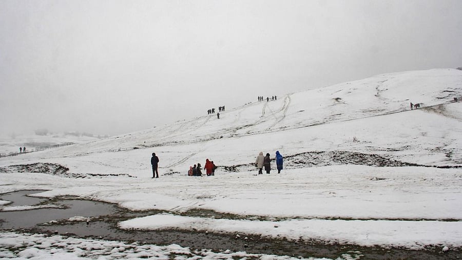 A view of the snow covered Gulmarg during the season's first snowfall, in Baramulla district, Saturday, October 23, 2021. Credit: PTI Photo