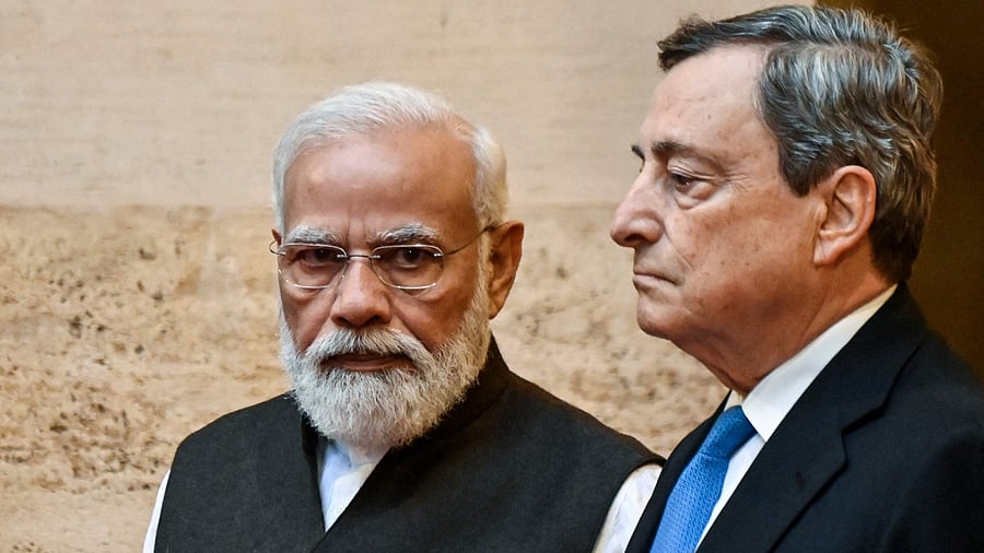 Italy's Prime Minister, Mario Draghi (R) greets Indian Prime Minister Narendra Modi upon his arrival for their meeting at the Chigi palace in Rome on October 29, 2021, ahead of an upcoming G20 summit of world leaders to discuss climate change, Covid-19 and the post-pandemic global recovery. Credit: AFP Photo