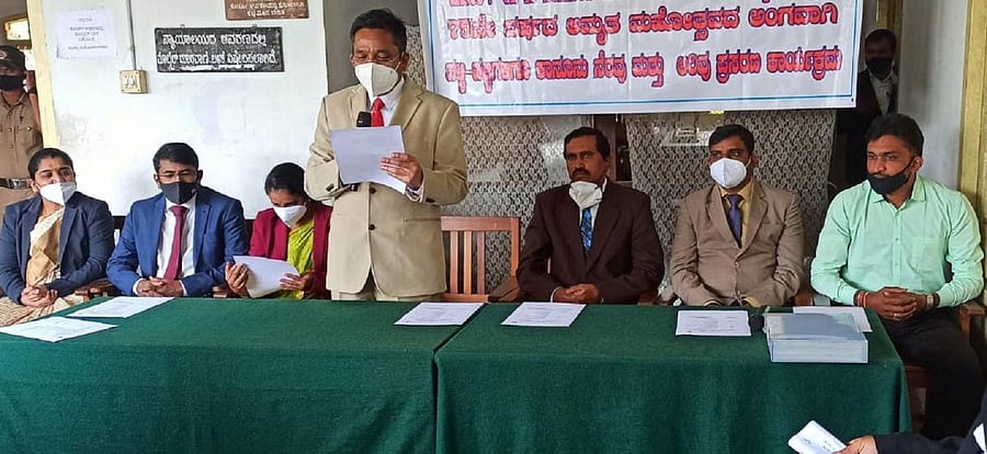 Principal District and Sessions Court Judge B L Jinaralakar speaks during an awareness programme at the district court premises in Madikeri.