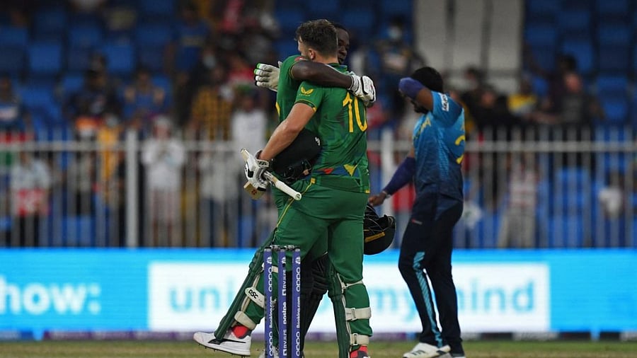 South Africa's David Miller (R) and teammate Kagiso Rabada celebrate their win in the ICC men’s Twenty20 World Cup cricket match between South Africa and Sri Lanka. Credit: AFP Photo