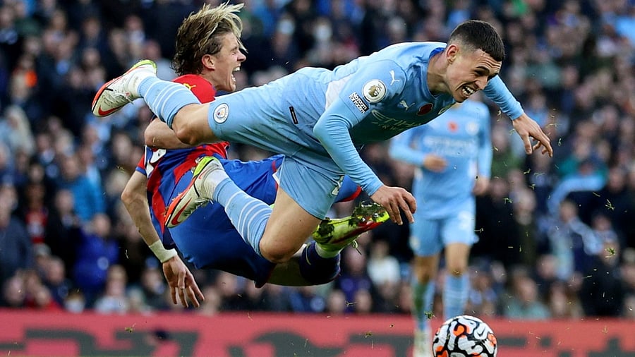 Manchester City's Phil Foden in action with Crystal Palace's Conor Gallagher. Credit: Reuters Photo