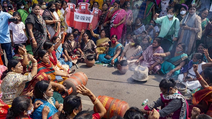 Biju Janata Dal (BJD) women’s wing stage a demonstration against hike in prices of essential commodities, in Bhubaneswar. Credit: PTI Photo