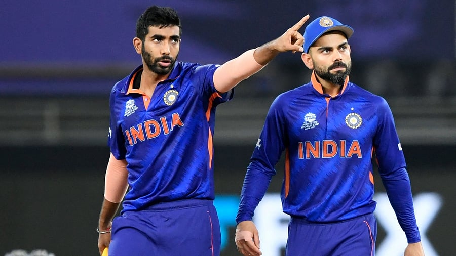 India's Jasprit Bumrah (L) gestures as captain Virat Kohli watches during the ICC men’s Twenty20 World Cup cricket match between India and New Zealand at the Dubai International Cricket Stadium in Dubai on October 31, 2021. Credit: AFP Photo
