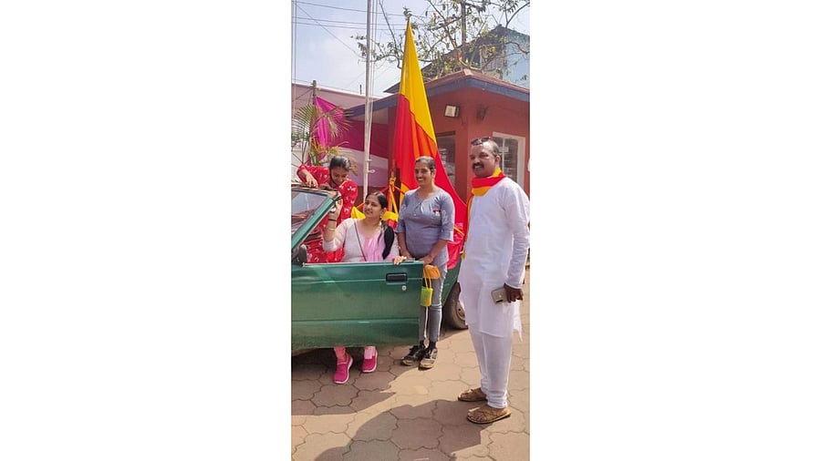 Tommy Thomas with his vehicle and family members.
