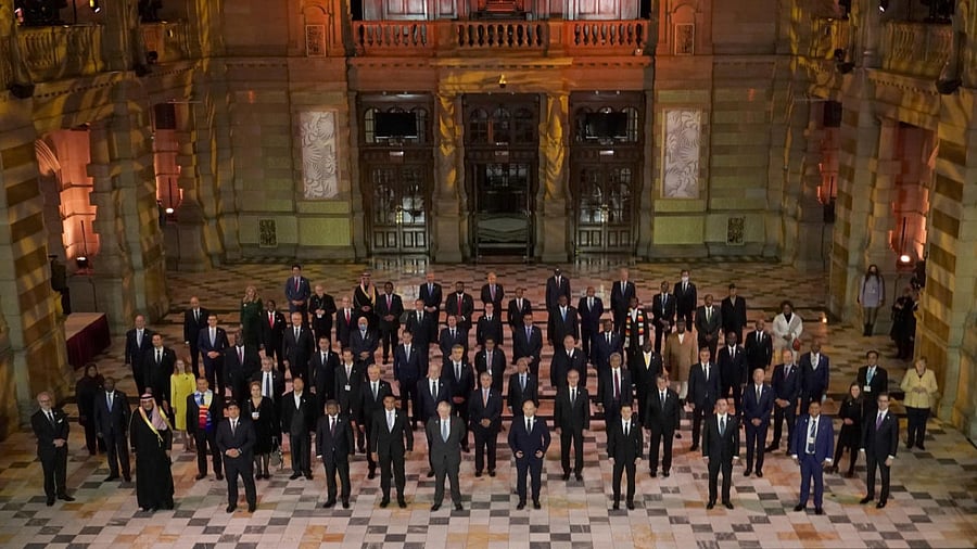 World Leaders pose for a group photo during an evening reception to mark the opening day of the COP26 UN Climate Summit, in Glasgow. Credit: AP Photo