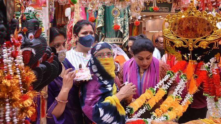 Women shop at the Sisamau market on the eve of Dhanteras. Credit: PTI Photo