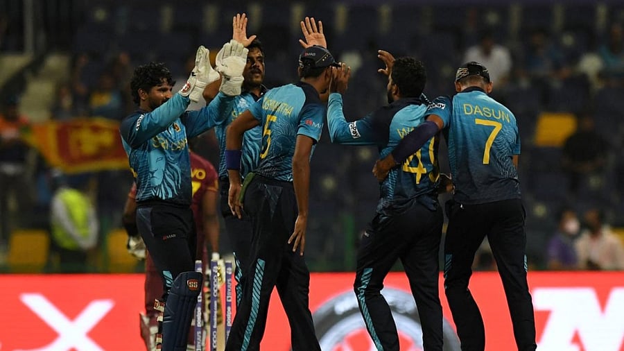 Sri Lanka's cricketers celebrates after the dismissal of West Indies' Dwayne Bravo during the ICC men’s Twenty20 World Cup cricket match between West Indies and Sri Lanka at the Sheikh Zayed Cricket Stadium in Abu Dhabi. Credit: AFP Photo