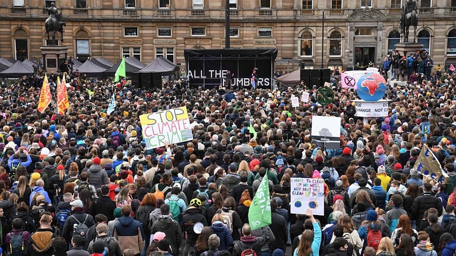 Protesters listen to speeches in George Square the end point for the Fridays For Future rally in Glasgow. Credit: AFP Photo
