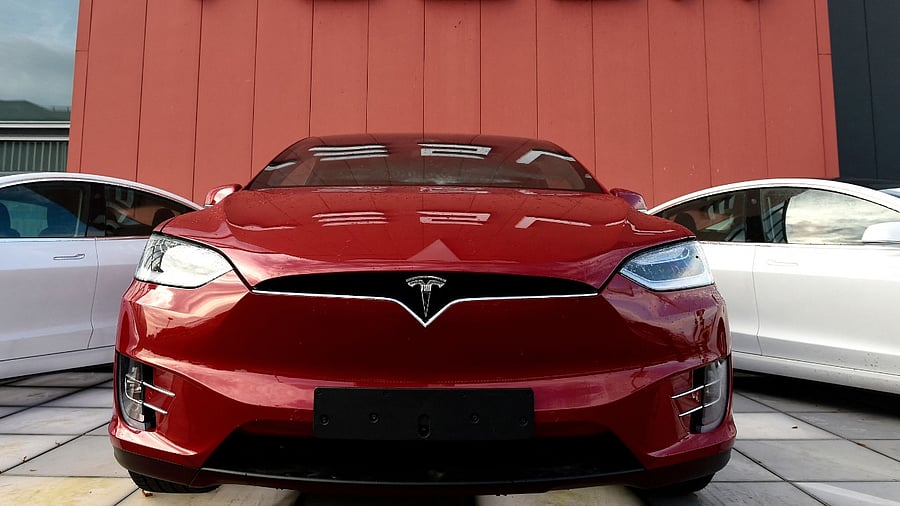 Tesla shares surged October 25, 2021, briefly lifting the electric car company's market value above $1 trillion, as investors shrugged off criticism from a US safety official of the fast-growing organisation. Credit: AFP File Photo