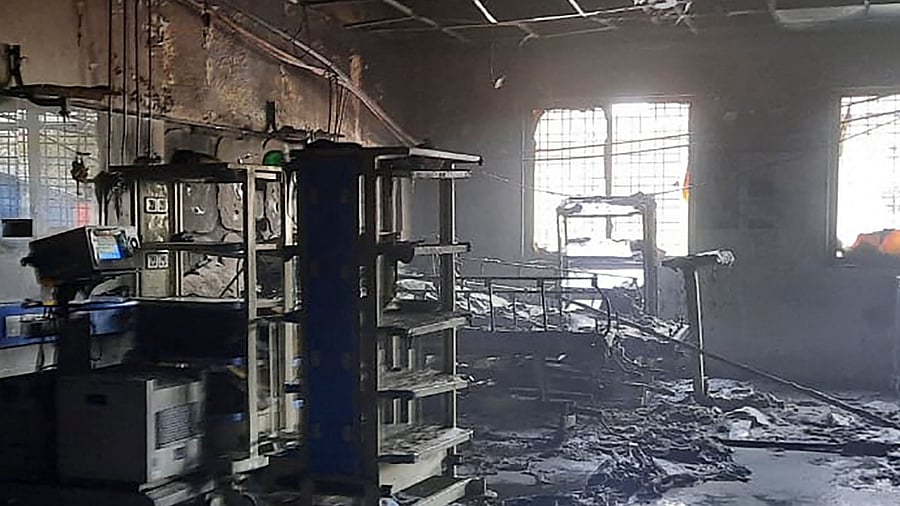 Charred remains of the medical equipment and bed is pictured inside a ward after a fire broke out at a hospital in Ahmednagar. Credit: AFP Photo