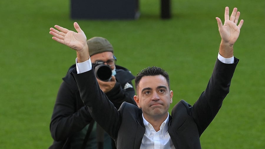 Newly-appointed FC Barcelona's Spanish coach Xavi Hernandez waves to supporters. Credit: AFP Photo