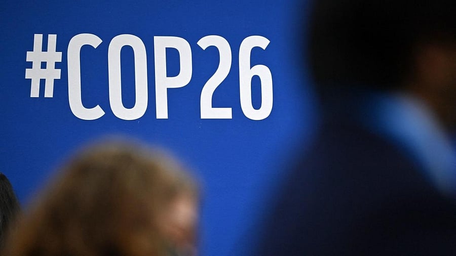 A COP26 sign is pictured during an event on the sidelines of the COP26 UN Climate Change Conference in Glasgow. Credit: AFP Photo