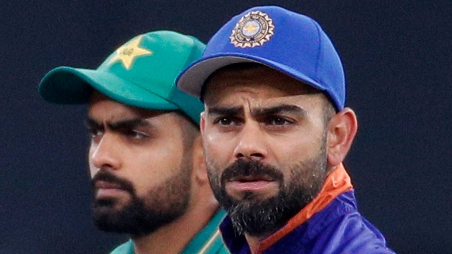 India team skipper Virat Kohli alongside Pakistan team skipper Babar Azam. Credit: Reuters Photo