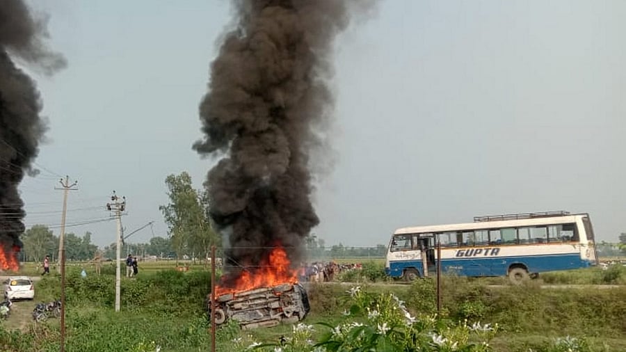 A vehicle set ablaze after violence broke out after farmers agitating were allegedly run over by a vehicle in the convoy of a union minister, in Lakhimpur Kheri, Sunday, October 3, 2021. Credit: PTI File Photo