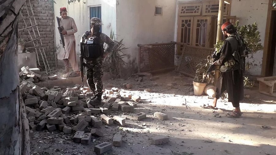 Taliban fighters inspect at the site roadside bombing in Jalalabad east of Kabul. Credit: AP/PTI file photo