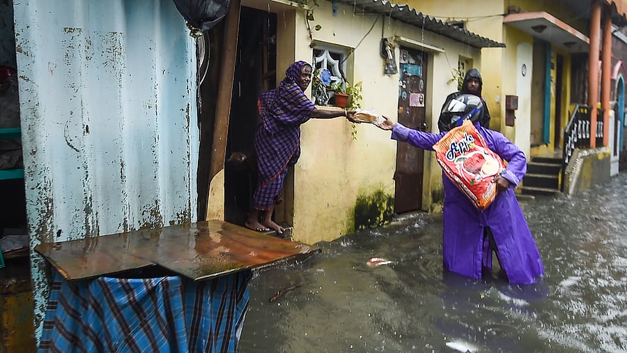 Residents at a waterlogged area of KM Garden following heavy rain, in Chennai. Credit: PTI Photo
