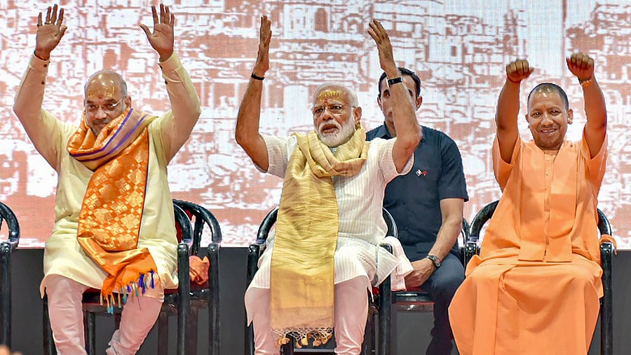Prime Minister Narendra Modi with Union Minister Amit Shah and UP CM Yogi Adityanath. Credit: PTI Photo