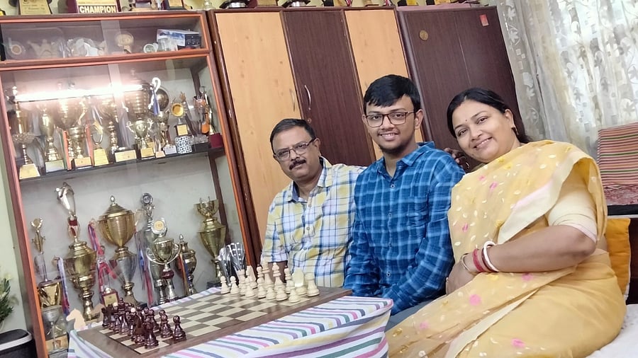 Mitrabha Guha, the 72nd chess grandmaster from India, with his parents at his home. Credit: DH Photo