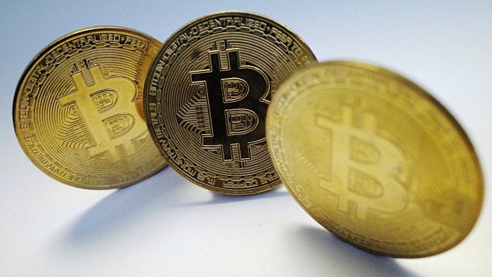 Srikrishna Ramesh alias Sriki's (below) exploits have led to a full-fledged political slugfest in Karnataka. An engineer works on a cryptocurrency farm in Romania. Credit: Reuters Photo