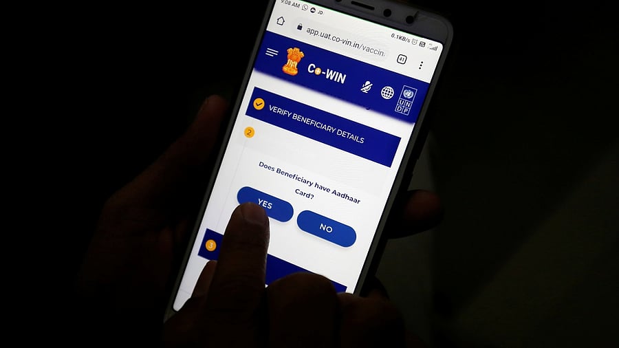 A healthcare worker enters data into the Co-WIN app, a digital platform being used for vaccinations. Credit: Reuters File Photo