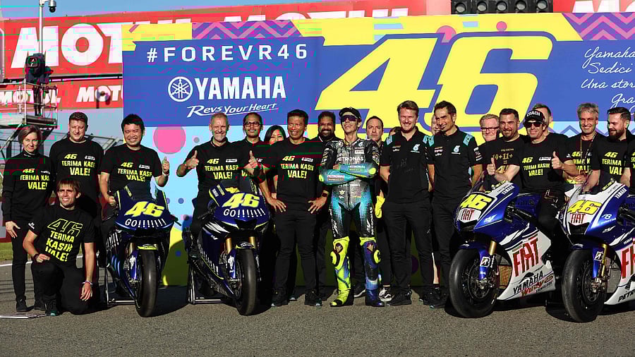 Valentino Rossi (centre) with his SRT Yamaha teammates. Credit: AFP Photo