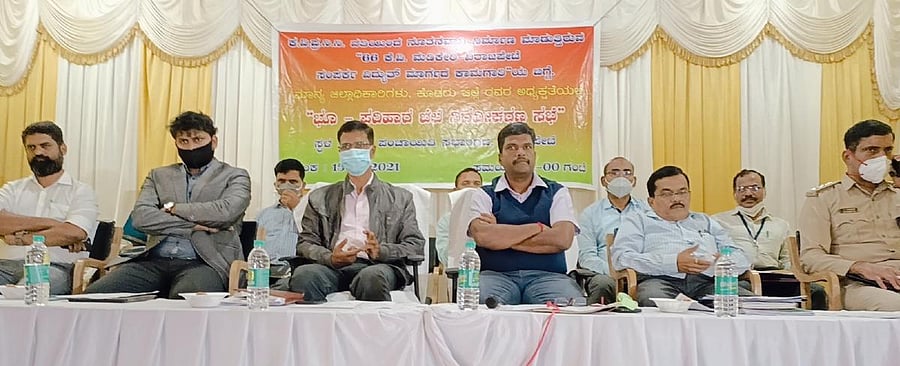 Deputy Commissioner Dr B C Sateesha, Additional DC Raju Mogaveera, AC Iswar Kumar Kandoo and others take part in a meeting in Virajpet.