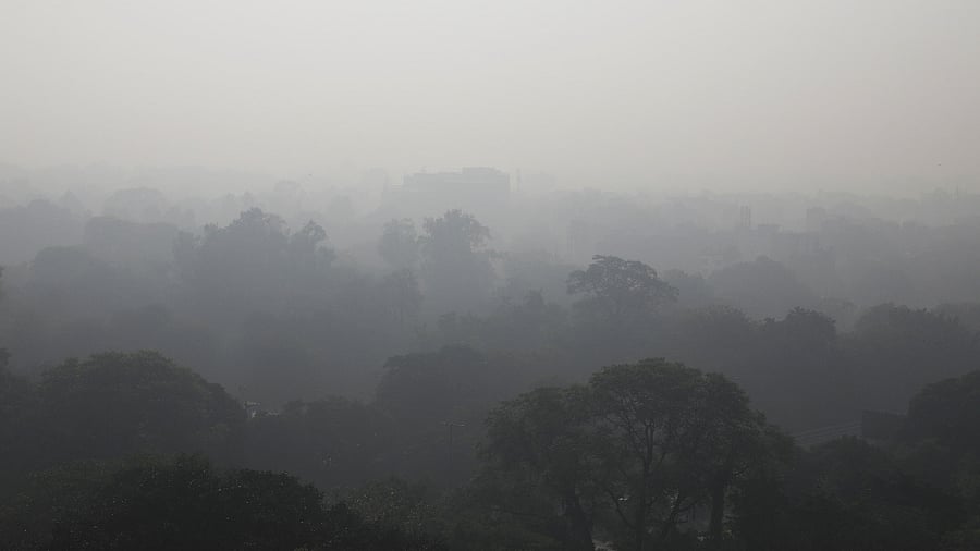 Buildings are seen shrouded in smog in New Delhi. Credit: Reuters photo
