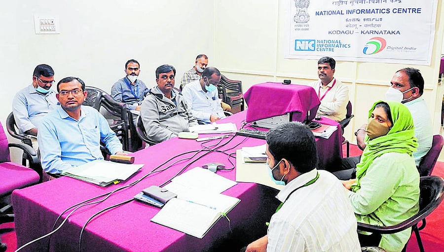 Deputy Commissioner Dr B C Sateesha at a video conference with Coffee Board CEO Dr K G Jagadeesh.