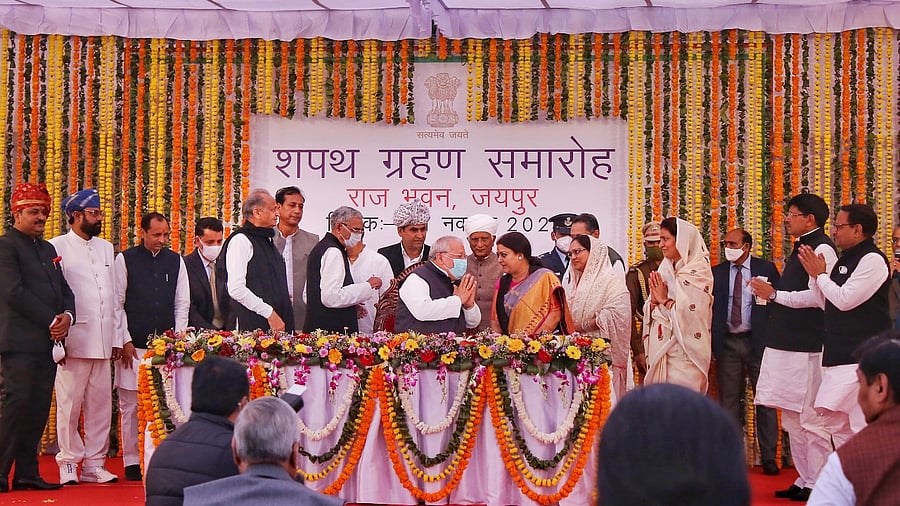 Rajasthan Chief Minister Ashok Ghelot and Rajasthan Governor Kalraj Mishra pose with new Cabinet Ministers after the swearing-in ceremony at Raj Bhawan in Jaipur. Credit: PTI Photo
