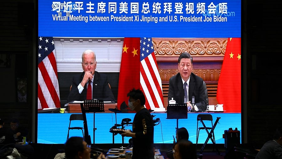 Screen shows Chinese President Xi Jinping attending a virtual meeting with US President Joe Biden via video link, at a restaurant in Beijing. Credit: Reuters File Photo