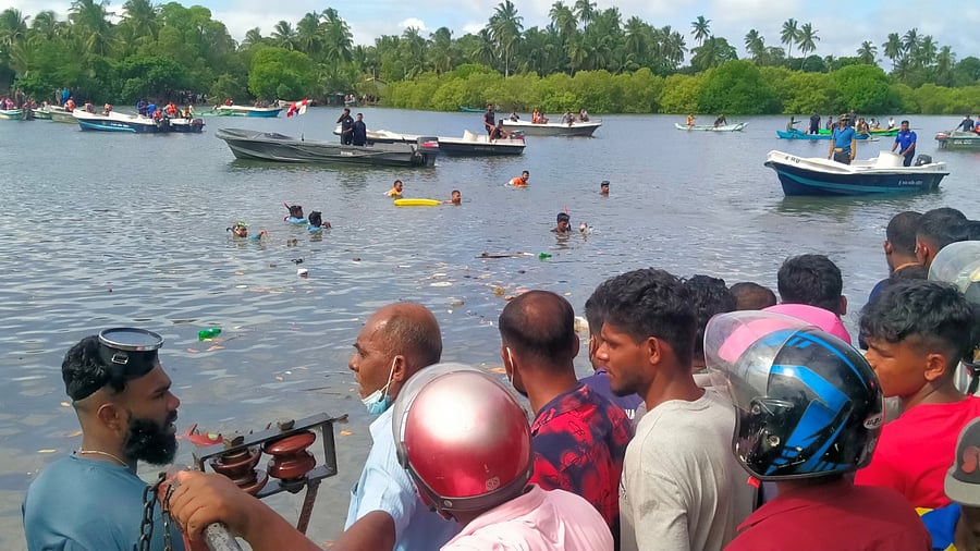 Sri Lankan navy carries a rescue operation near the site of the capsized ferry in Kinniya, east of capital Colombo, Sri Lanka. Credit: Reuters Photo