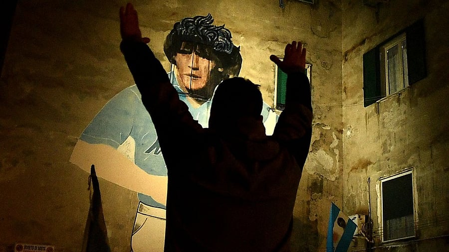 Fans pay tribute to Diego Maradona at Naples in Italy. Credit: AFP Photo