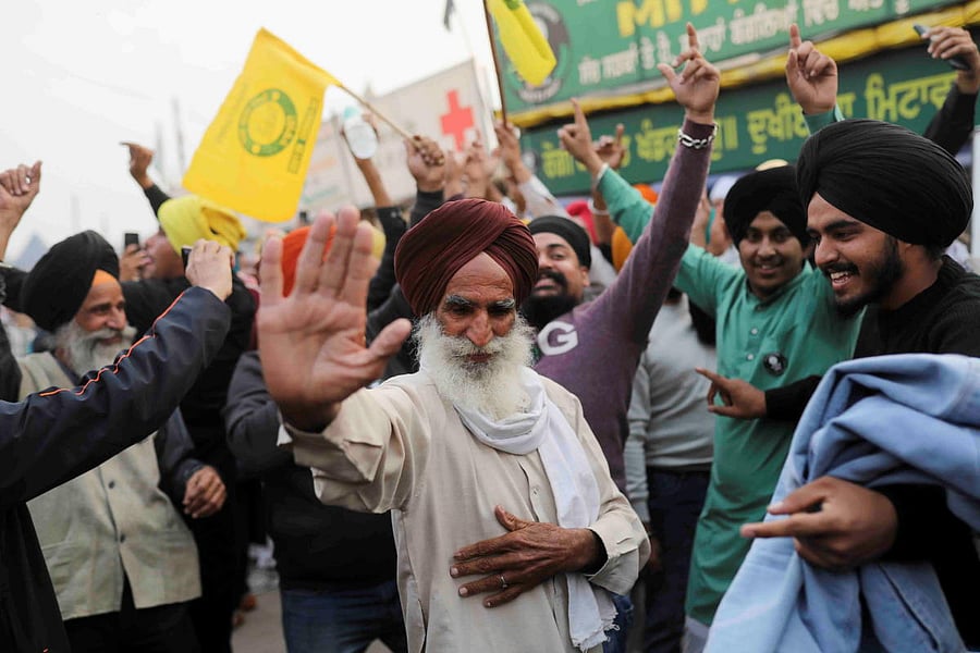 Farmers cheer PM Narendra Modi’s decision to repeal contentious laws. 