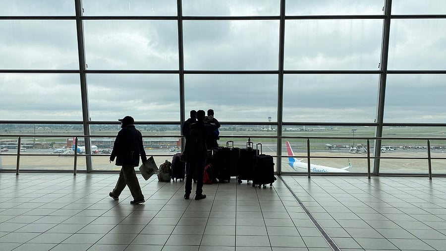 Passengers wait to board flights, amidst the spread of the Omicron variant, at O.R. Tambo International Airport in Johannesburg, South Africa. Credit: Reuters File Photo