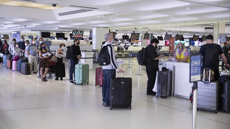 Passengers line up for Covid-19 check at Sydney Airport. Credit: IANS Photo
