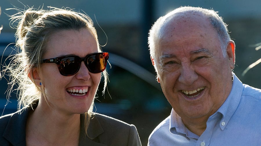 Zara founder Amancio Ortega with daughter Marta Ortega. Credit: AFP Photo