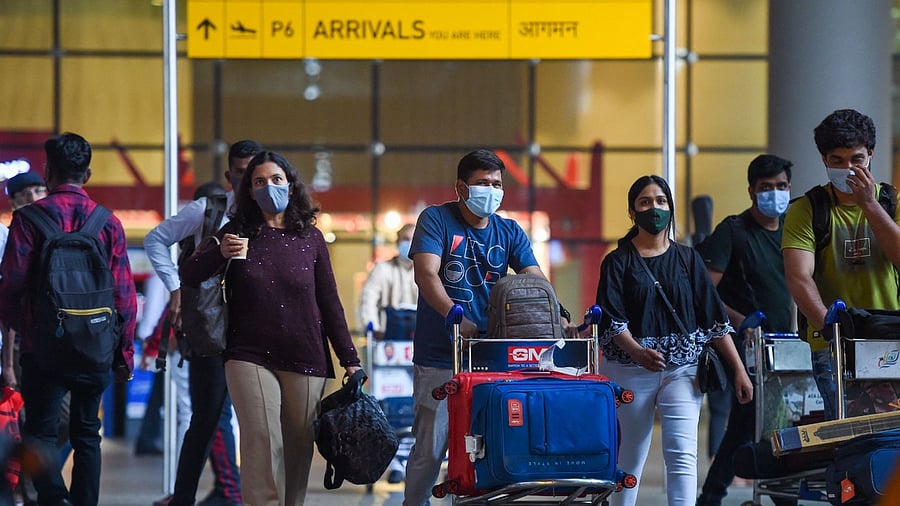 Under the new guidelines issued by the Union Health Ministry on November 28, passengers originating or transiting from at-risk countries will have to undergo RT-PCR testing post-arrival and will be required to wait for the results at the airport before leaving or taking a connecting flight. Credit: AFP File Photo