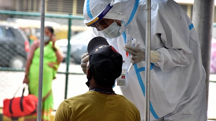 Issuing a set of Frequently Asked Questions (FAQs), the ministry said that travellers undergoing random sampling may give the sample and be allowed to leave. Credit: DH File Photo