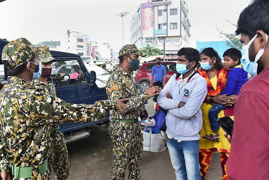 BBMP marshals at a crowded market in Bengaluru.