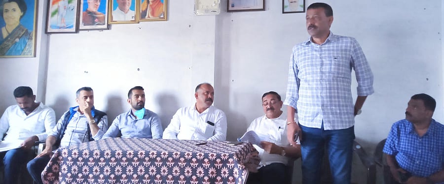 District Congress Committee working president Titira Dharmaja Uttappa speaks at a meeting by the Gonikoppa Congress committee.
