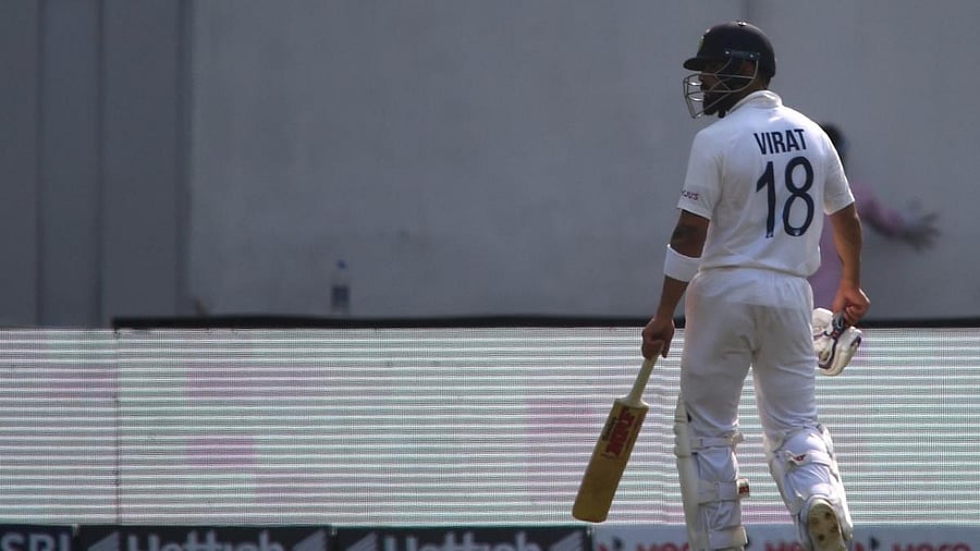 Virat Kohli walks back to the pavilion after his dismissal on the first day of the second Test cricket match between India and New Zealand at the Wankhede Stadium in Mumbai. Credit: AFP Photo