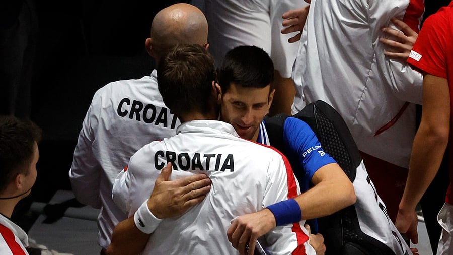Serbia's Novak Djokovic with Croatia team member after the match. Credit: Reuters Photo