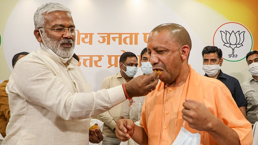 Uttar Pradesh Chief Minister Yogi Adityanath with BJP state President Swatantra Dev Singh. Credit: PTI File Photo