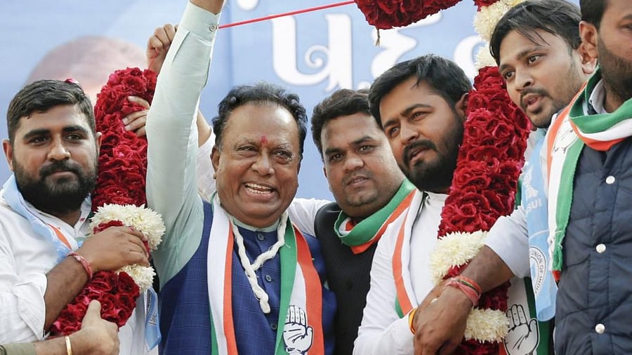 Newly appointed Gujarat Congress President Jagdish Thakor greets party workers while being garlanded during a function to take charge of the office, at Rajiv Gandhi Bhavan in Ahmedabad. Credit: PTI photo