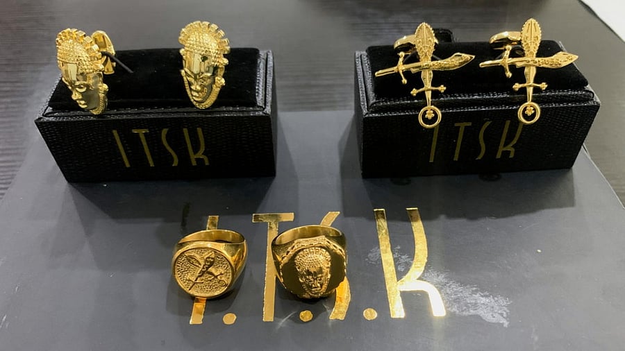 Gold-finished Nigerian fashion accessories inspired from cultural symbols are seen on display at the ITSK Gold office in Lagos, Nigeria. Credit: Reuters photo